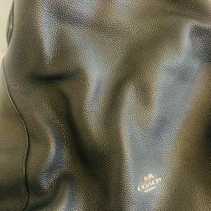 Is new black coach that leader very clean not used original is big bags